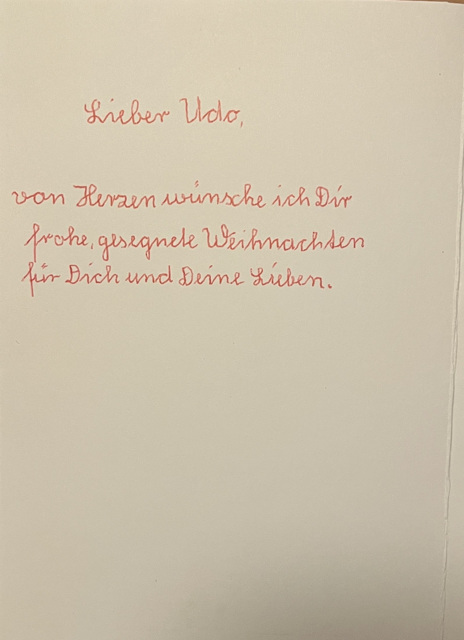 Innenseite der Weihnachtskarte mit dem Gruß in roter Schrift